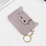 Porte-cartes kawaii en cuir violet.