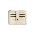 Porte carte en cuir beige.