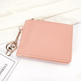 Porte carte et monnaie pour femme en cuir rose.