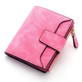 Porte cartes portefeuille en cuir rose vif.