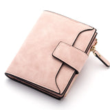 Porte cartes portefeuille en cuir rose.