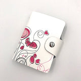 Des dessins au crayon sont faits sur un porte-cartes en cuir blanc pour femme.