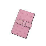 Porte-cartes pour femme en cuir d'autruche rose.
